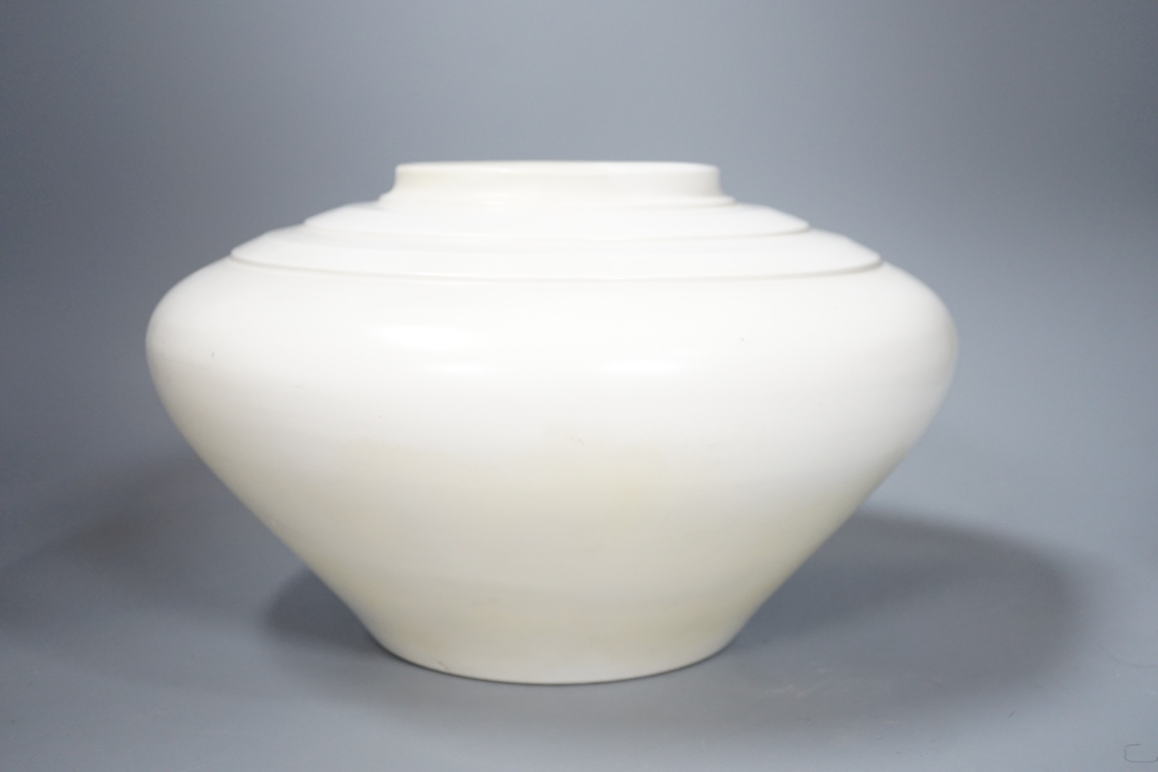 A large Keith Murray moonstone vase, restored, 26cm diameter